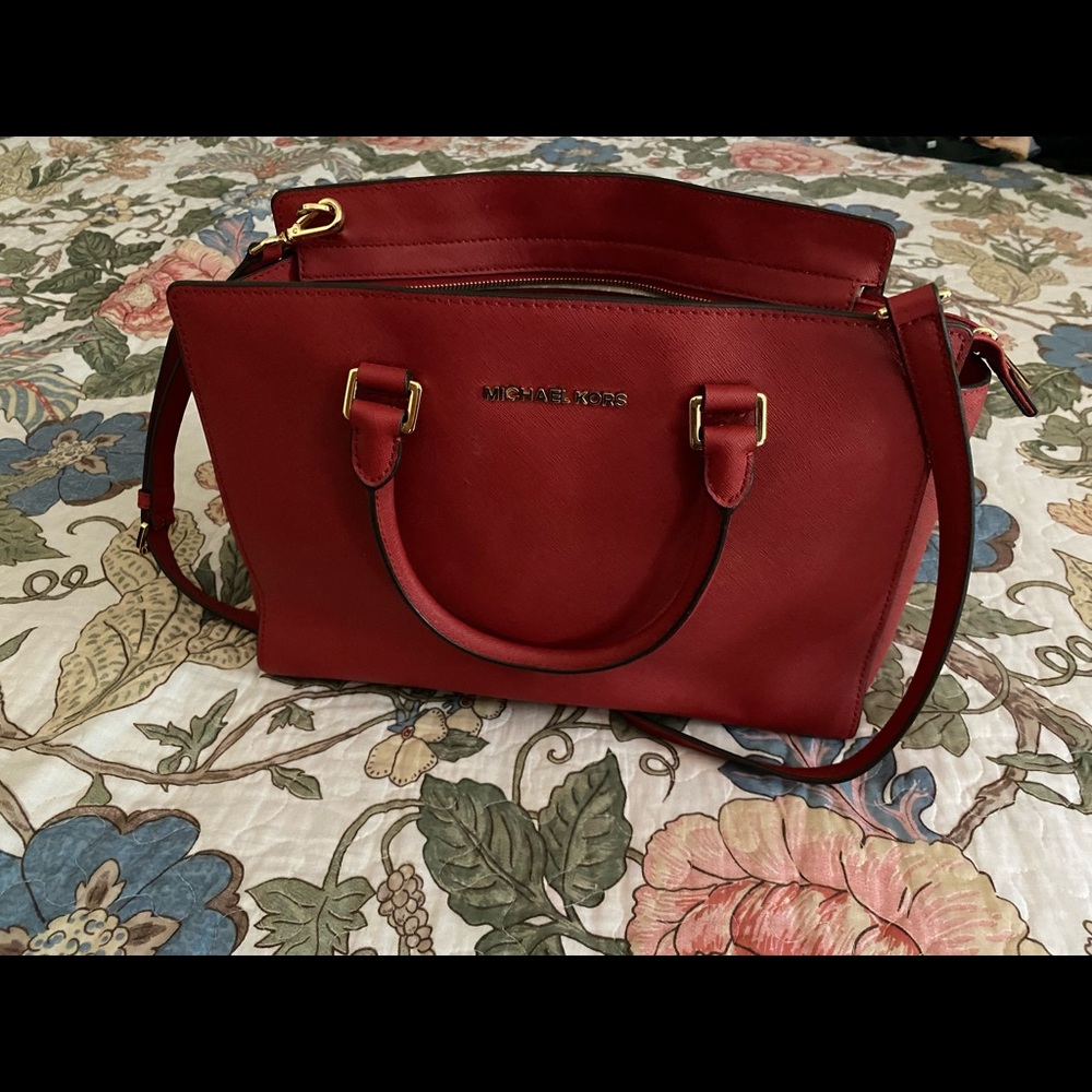 Red Michael Kors satchel.